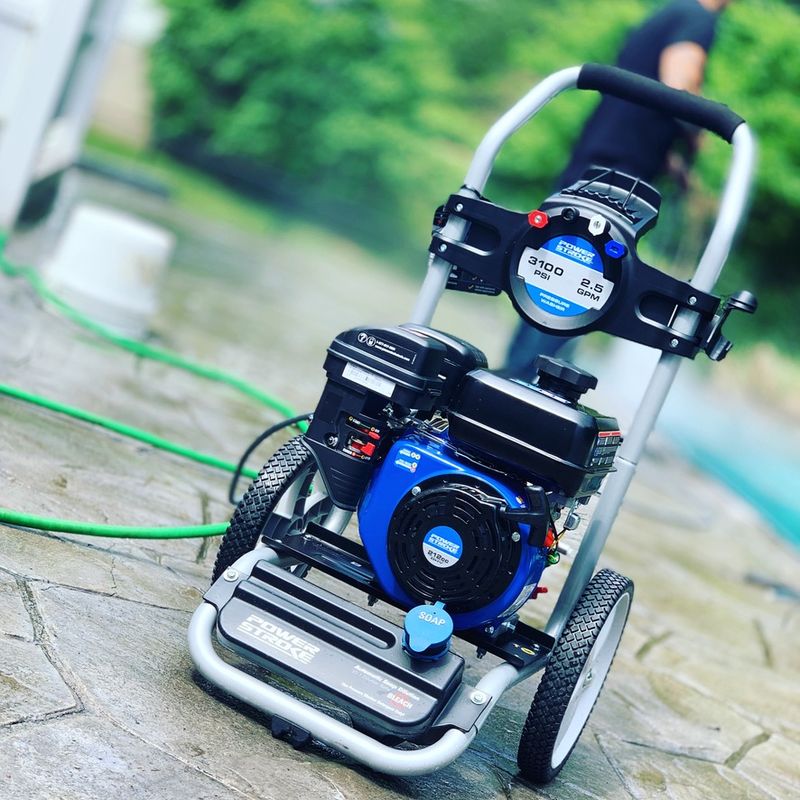 Power washing a residential driveway and walkway