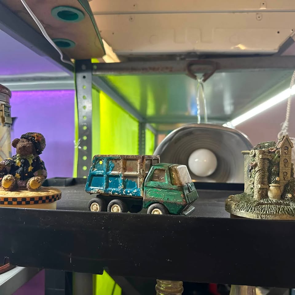 Vintage die-cast toy truck and figurines at Jimmy's Junk